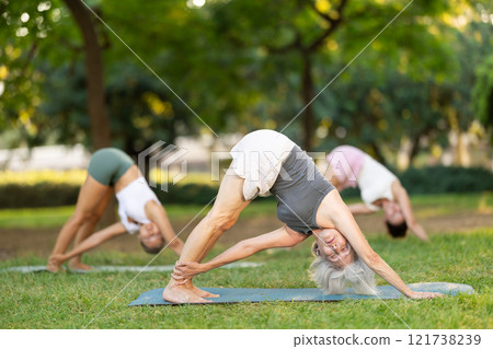Young woman doing yoga in park 121738239