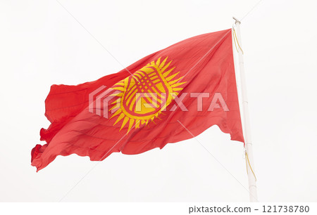 Kyrgyzstan flag is waving in Ala-Too Square 121738780