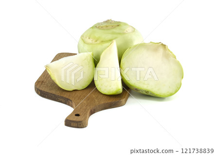 Fresh Kohlrabi on a Cutting Board with Slices Visible Fresh Kohlrabi on a Cutting Board with Slices Visible 121738839