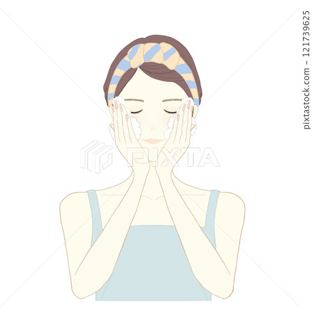 Woman washing her face with foam 121739625