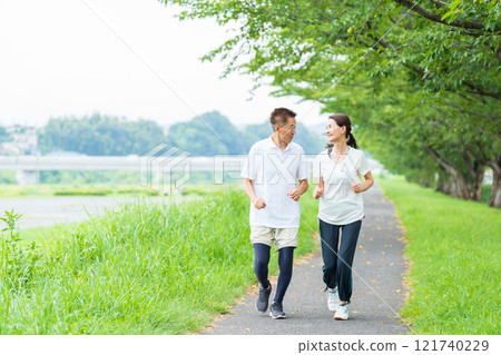 Senior couple doing jogging 121740229