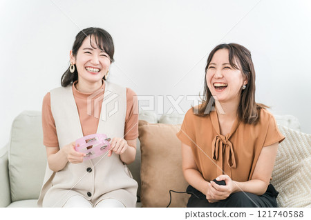 Young asian woman singing karaoke at home 121740588