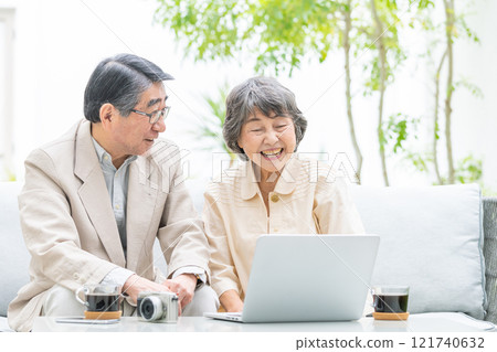 Senior couple talking on a video call Senior couple talking on a video call 121740632