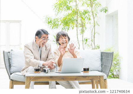 Senior couple talking on a video call 121740634