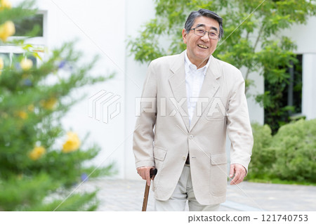 Senior man walking with a cane Senior man walking with a cane 121740753
