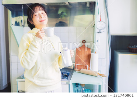 A woman drinking coffee A woman drinking coffee 121740901