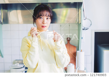 A woman drinking soup 121740903