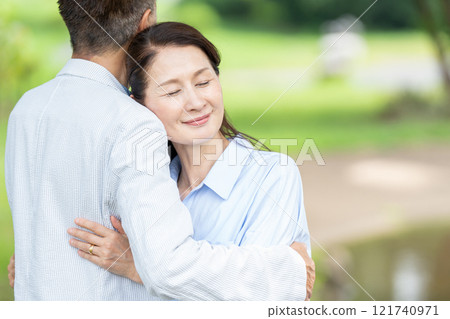 Senior couple with cuddling smile Senior couple with cuddling smile 121740971