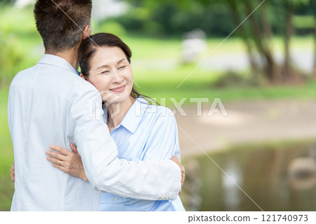 Senior couple with cuddling smile 121740973