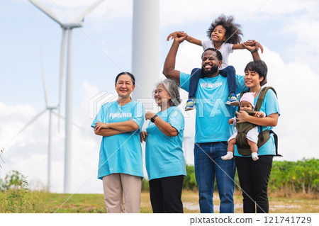 family of five is standing in a field with a windmill in the background family of five is standing in a field with a windmill in the background 121741729