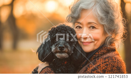 Heartwarming scene of elderly woman lovingly embracing small dog Heartwarming scene of elderly woman lovingly embracing small dog 121741853
