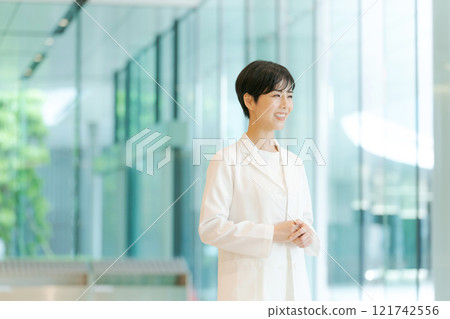 A young lady in white 121742556