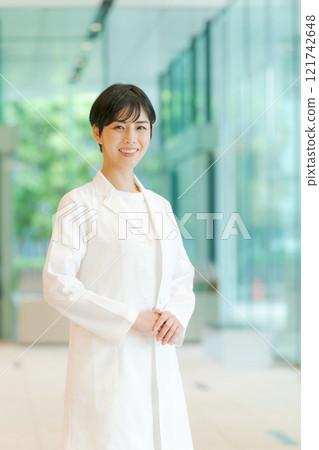 A young lady in white 121742648