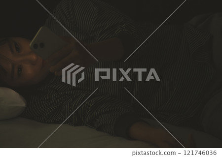 While sleeping, a smartphone While sleeping, a smartphone 121746036