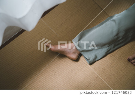 Tatami mat and barefoot woman 121746083