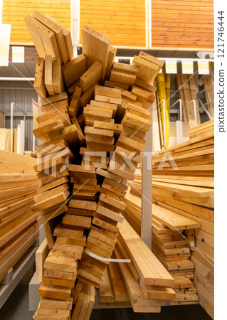 Stacks of wooden planks and boards 121746444