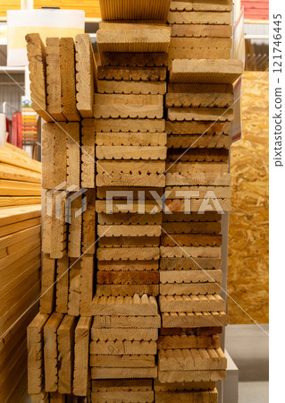 Stacks of wooden planks and boards 121746445