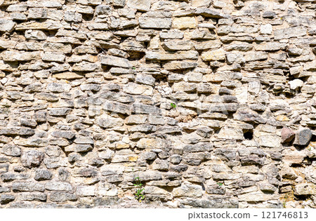 Rough gray stone wall as creative background. Grunge wall texture background Rough gray stone wall as creative background. Grunge wall texture background 121746813