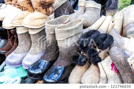 Traditional felted boots of different design. Russian national shoes felt footwear 121746830