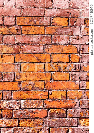 Old red brick wall as creative background. Rough bricks masonry with seams as texture 121746846
