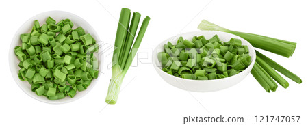 Green onion in ceramic bowl isolated on the white background. Top view. Flat lay. Green onion in ceramic bowl isolated on the white background. Top view. Flat lay. 121747057