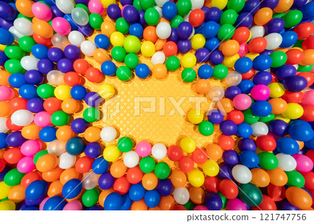 A vibrant display of colorful balloons forming a cheerful central focus. 121747756