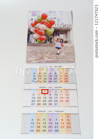 tear-off calendar with photos first of september on a white table. tear-off calendar with photos first of september on a white table. 121747823
