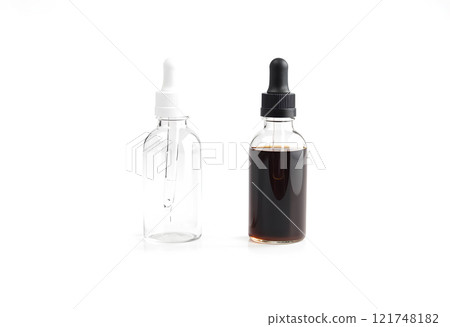 Blank glass dropper bottle with white and black label mockup. 121748182