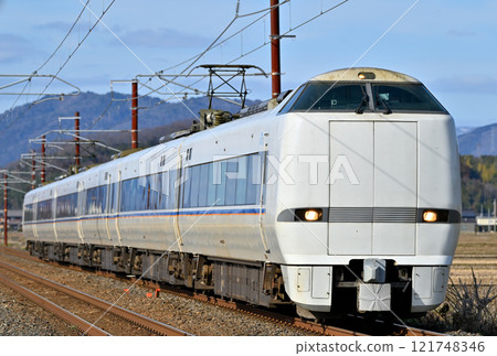 The Shirasagi Express train running in the setting sun 121748346