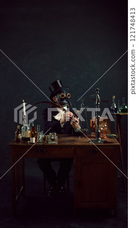 plague doctor named writing name for new medicine with feather quill, evoking themes of historical research and experimentation in vintage laboratory. plague doctor named writing name for new medicine with feather quill, evoking themes of historical research and experimentation in vintage laboratory. 121748413