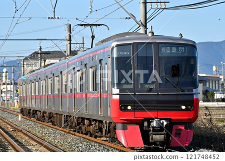 Meitetsu 3300 series train running in the morning sun 121748452