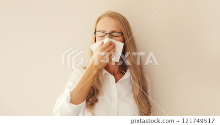 Sick exhausted young woman sneezing blow nose using tissue, unhealthy suffering girl feels unwell Sick exhausted young woman sneezing blow nose using tissue, unhealthy suffering girl feels unwell 121749517