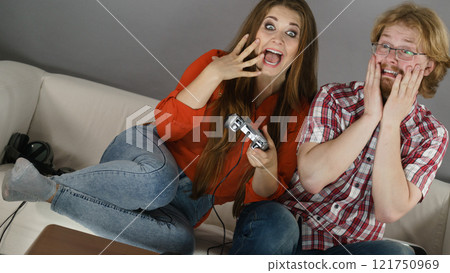 Gamer couple playing games 121750969