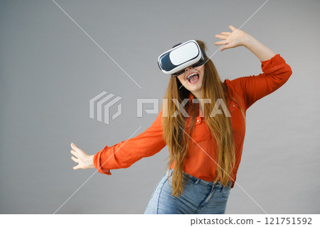 Girl wearing virtual reality goggles. Girl wearing virtual reality goggles. 121751592