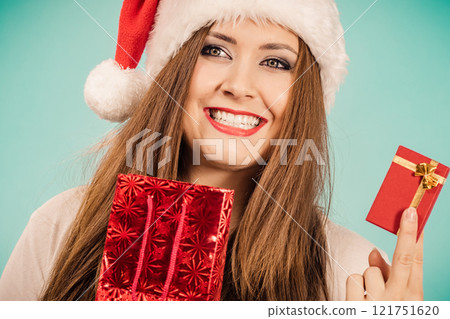 Happy Christmas woman holds red gift box Happy Christmas woman holds red gift box 121751620