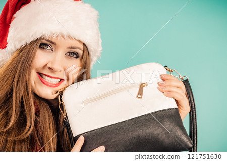 Christmas girl holding handbag present Christmas girl holding handbag present 121751630