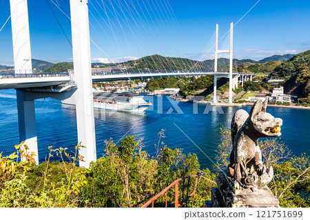 Cruise ship departing from Nagasaki Port (Adora Mediterranea) passing Megami Ohashi Bridge Kanzaki Shrine (Kankari Inari) [Nagasaki City] 121751699