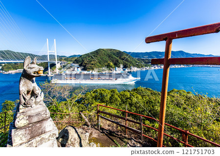 Cruise ship departing from Nagasaki Port (Adora Mediterranea) passing Megami Ohashi Bridge Kanzaki Shrine (Kankari Inari) [Nagasaki City] 121751703
