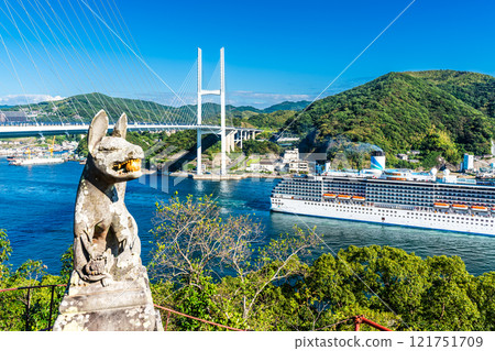 Cruise ship departing from Nagasaki Port (Adora Mediterranea) passing Megami Ohashi Bridge Kanzaki Shrine (Kankari Inari) [Nagasaki City] 121751709