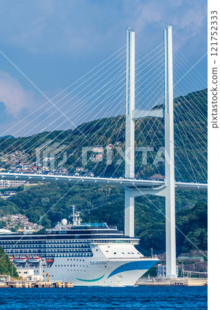 Passenger ship arriving at Nagasaki Port (Adora Mediterranea) passing Megami Ohashi Bridge from the Island of the Gods [Nagasaki City] 121752333