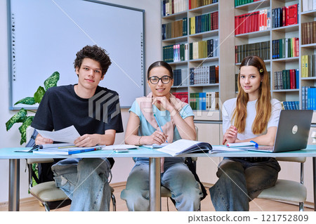 Group of high school students studying in library classroom 121752809