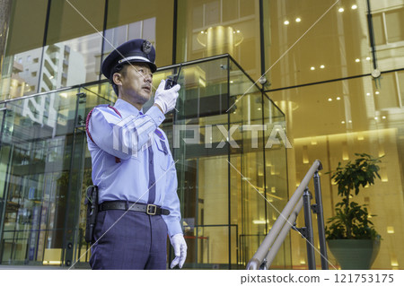 A middle-aged male security guard talking on a walkie-talkie. Photo courtesy of Denpa Gakuen, Tokyo Electronics College. A middle-aged male security guard talking on a walkie-talkie. Photo courtesy of Denpa Gakuen, Tokyo Electronics College. 121753175