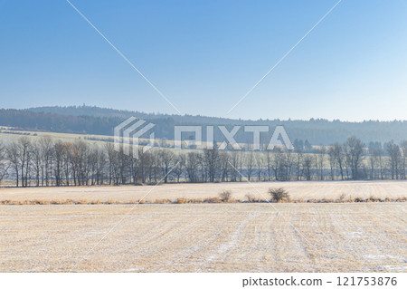 Winter snowy country at sunny day. Region Pilsen in Czech Republic, Europe. Winter snowy country at sunny day. Region Pilsen in Czech Republic, Europe. 121753876
