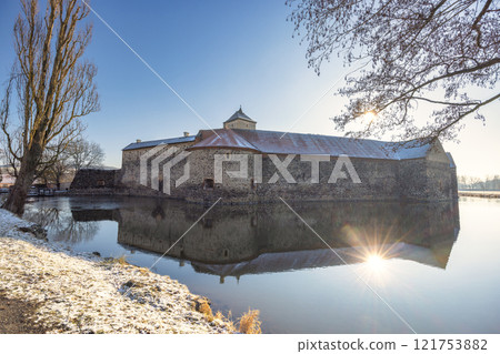Svihov castle surrounded by a moat in winter, medieval landmark in Region Pilsen in Czech Republic, Europe. 121753882