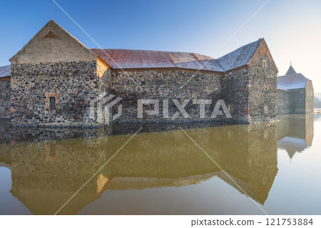 Svihov castle surrounded by a moat in winter, medieval landmark in Region Pilsen in Czech Republic, Europe. 121753884