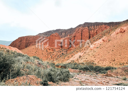 Konorchek canyon, sheer cliffs subject to erosion. Travel destination Kyrgyzstan 121754124