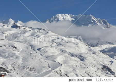 Skiing slopes, snowy Alpine landscape 121755207
