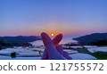 Rice terraces illuminated by a beautiful sunset 121755572