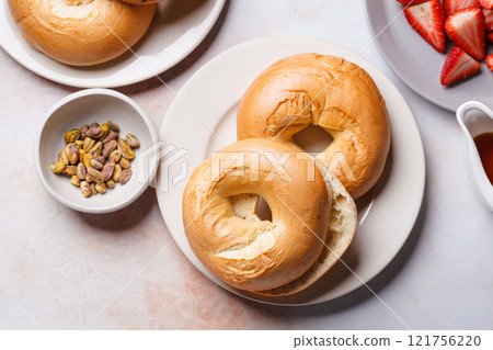 Breakfast bagels with strawberries. Breakfast bagels with strawberries. 121756220
