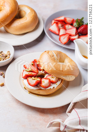 Breakfast bagels with cream cheese and strawberries. Breakfast bagels with cream cheese and strawberries. 121756221